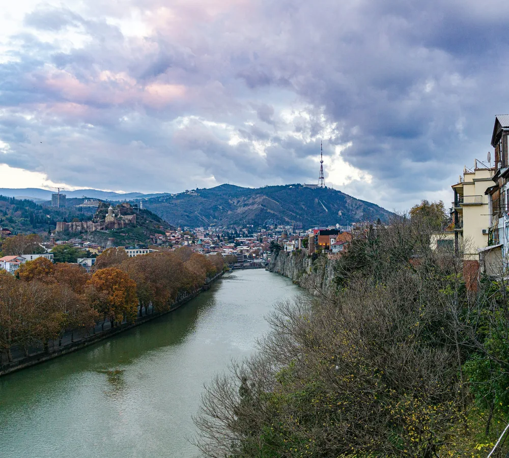 Tbilisi and the Mtkvari River with hills in the background